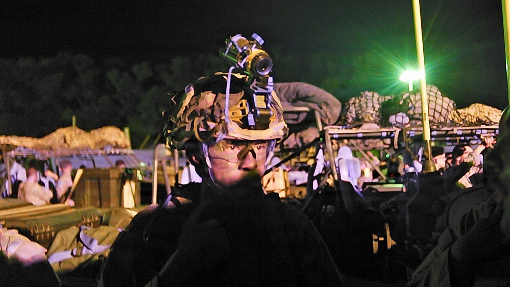 101st MFRC Soldier prepares for night combat simulation scenario at JRTC