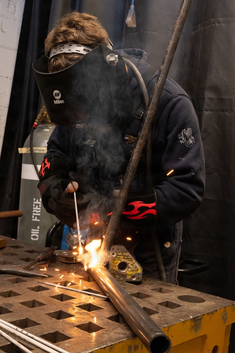Coast Guard Cutter Vigorous crew member conducts pre-deployment maintenance
