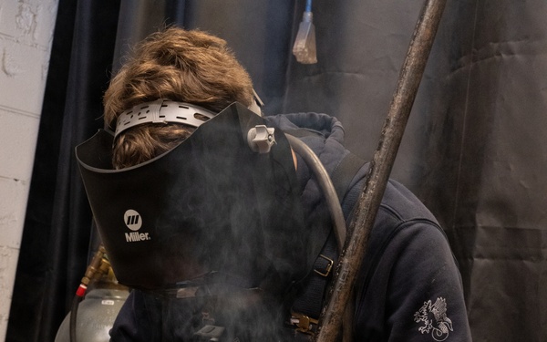 Coast Guard Cutter Vigorous crew member conducts pre-deployment maintenance