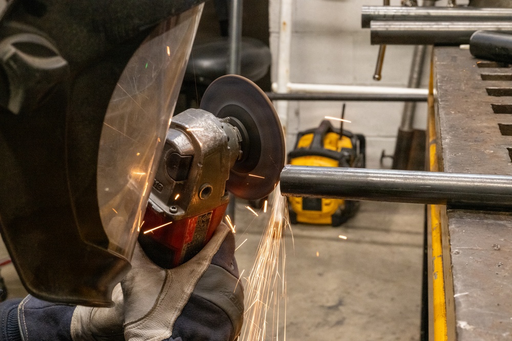 Coast Guard Cutter Vigorous crew member conducts pre-deployment maintenance