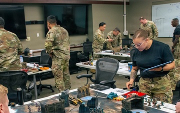 Students at the School of Advanced Military Studies enhance futures thinking, operational, tactical skills alongside successful wargame coach