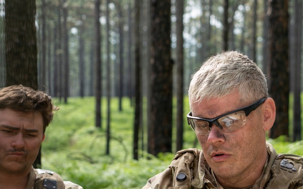 1st Sgt. Anthony Buchanan briefs leaders during JRTC mission planning at Fort Polk