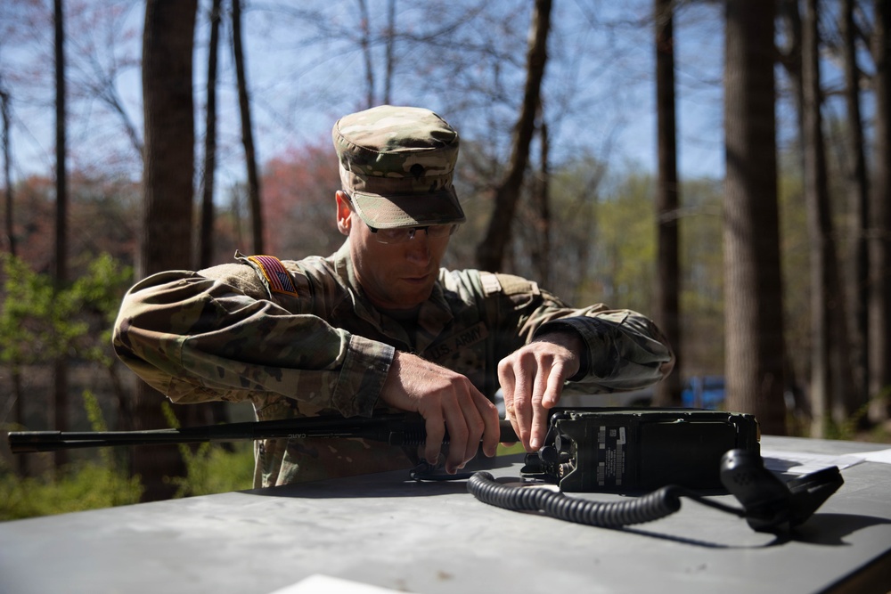 Maryland Army National Guard Soldier sets up a SINCGARS radio.