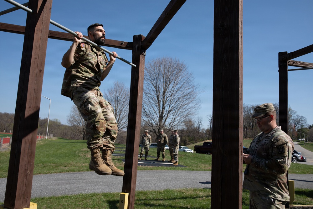 Soldier Performs Pull Up in Army Fitness Test