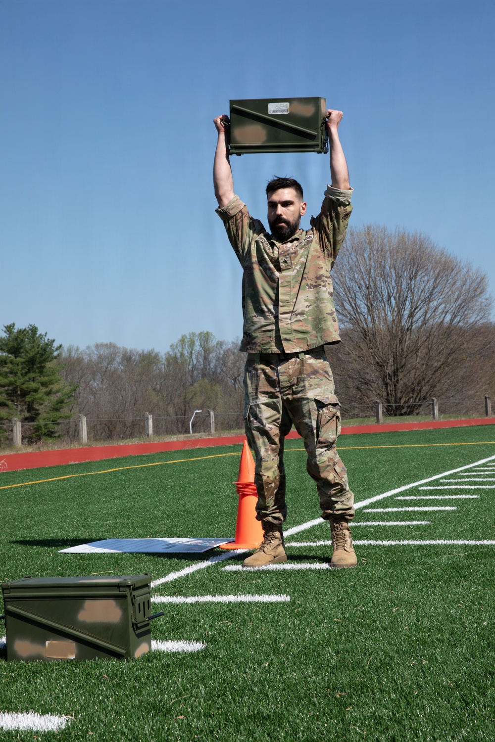 Soldier Lifts Ammo Can
