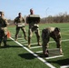 Soldiers perform the ammo can press