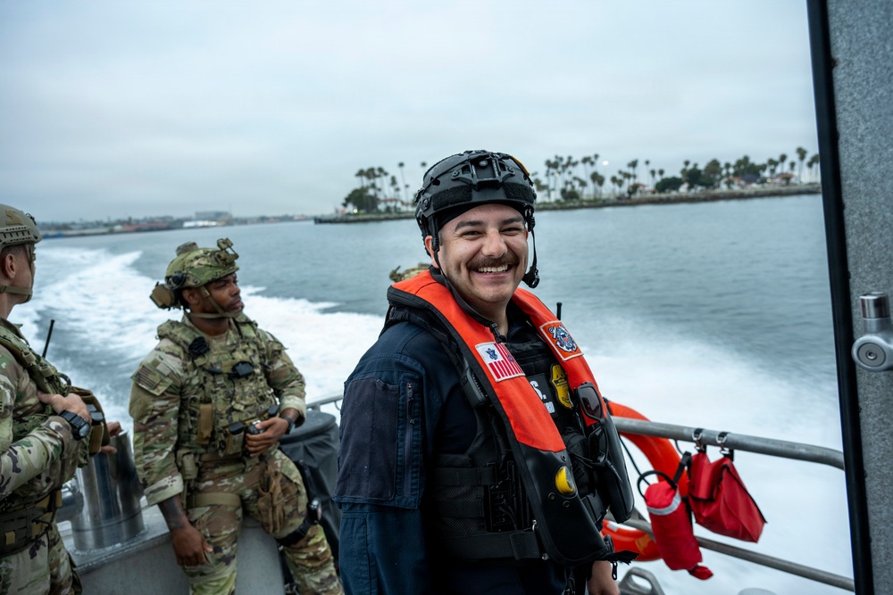 Coast Guard members conduct large vessel security boarding