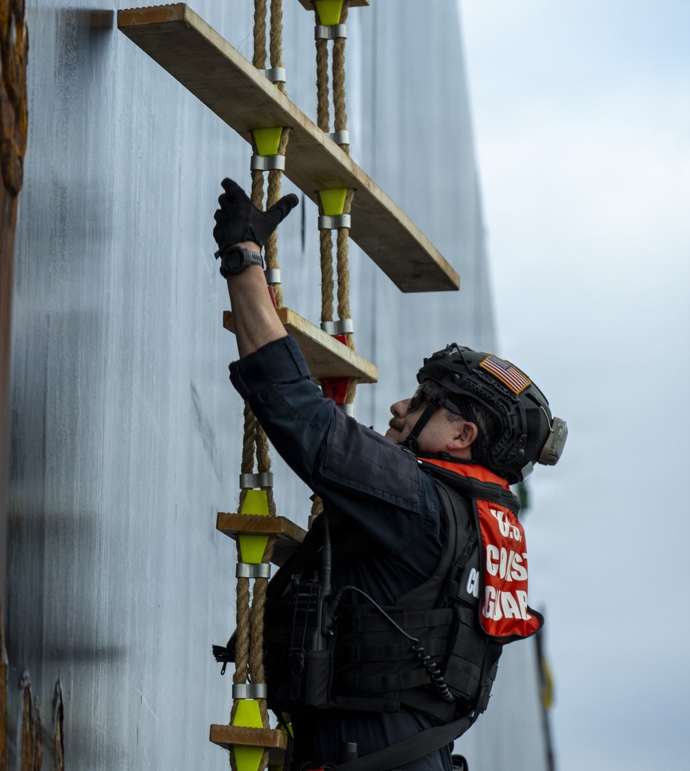 Coast Guard members conduct large vessel security boarding