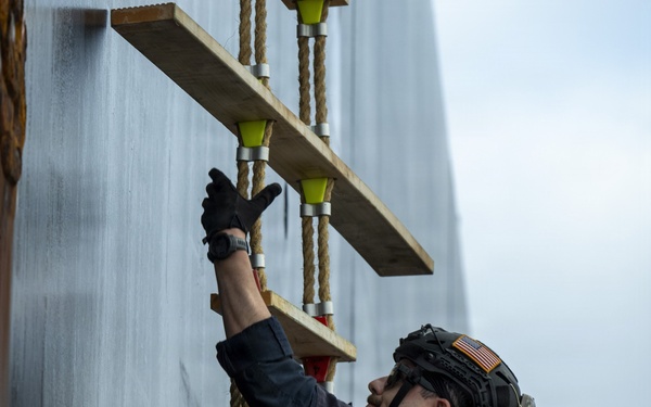 Coast Guard members conduct large vessel security boarding