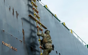 Coast Guard members conduct large vessel security boarding