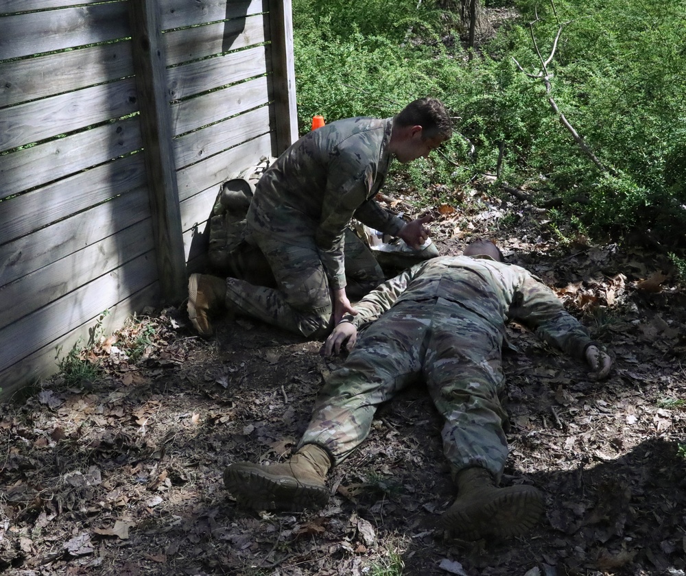 Soldier assesses a mock casualty