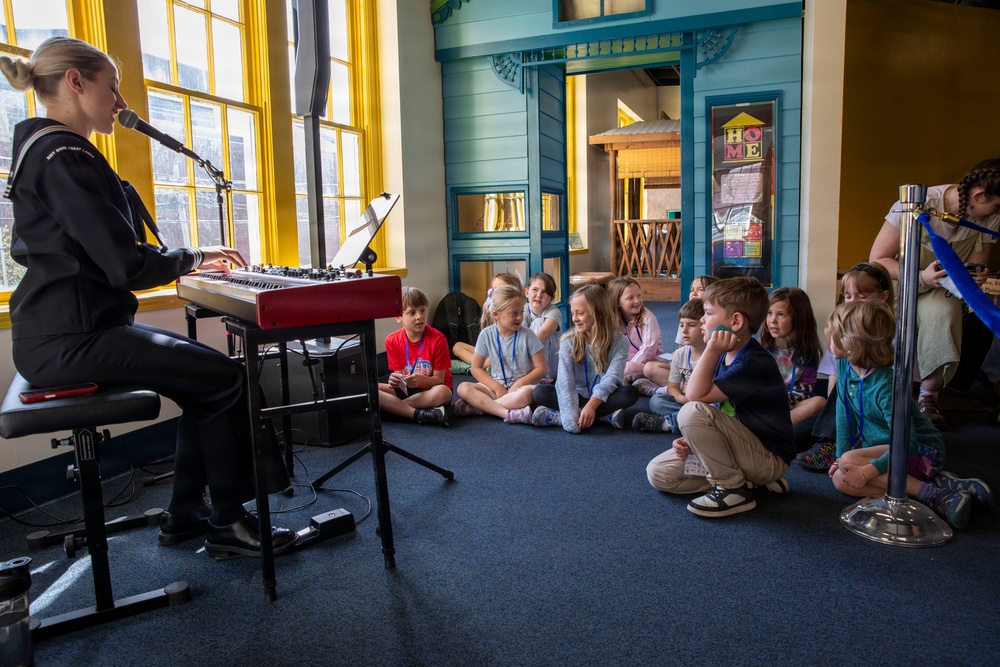 Sailor assigned to Navy Band Great Lakes preform at Lexington Children’s Museum