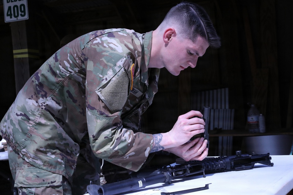 Soldier performs weapons check