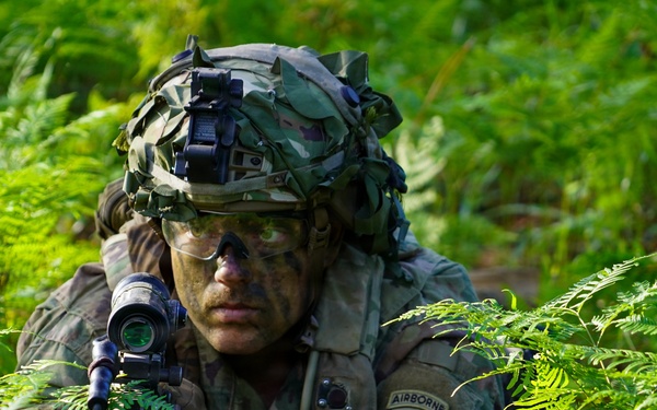 MFRC Soldier observes security with M249 SAW at JRTC
