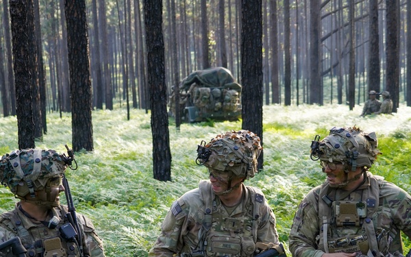 MFRC Soldiers discuss tactics and movement while training at JRTC