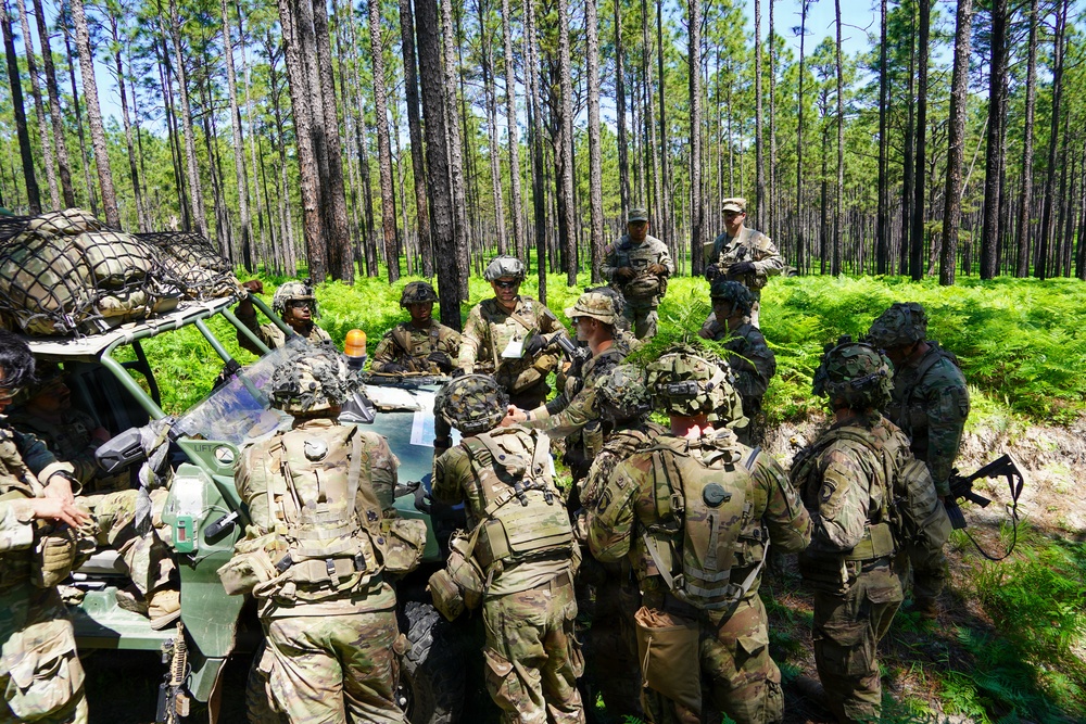 MFRC platoon leader briefs mission plat at JRTC