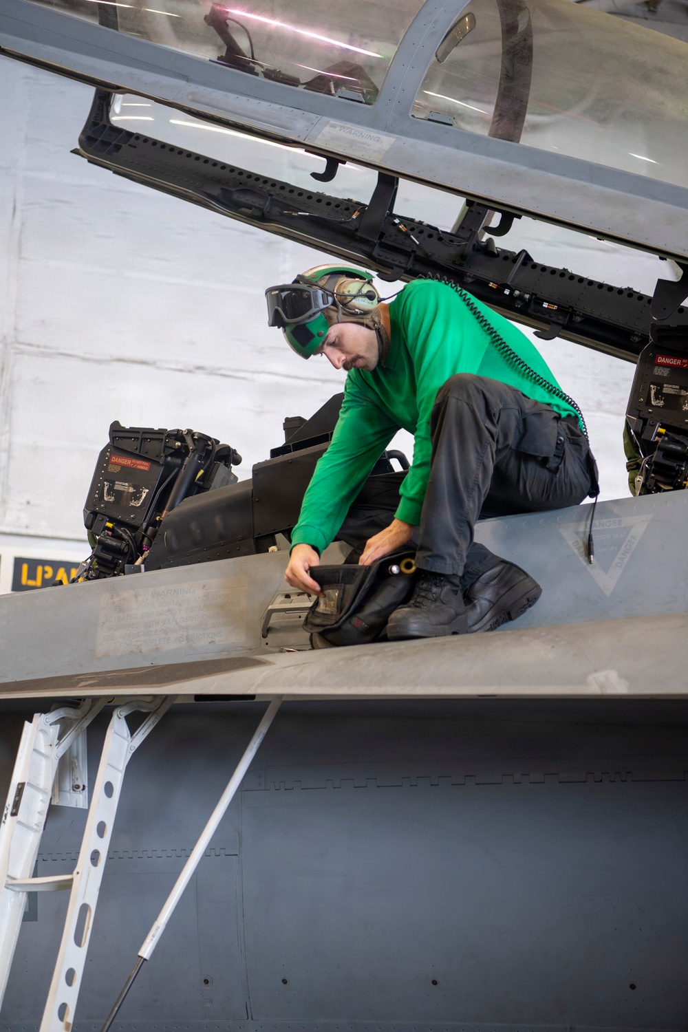 Sailor Conducts Maintenance