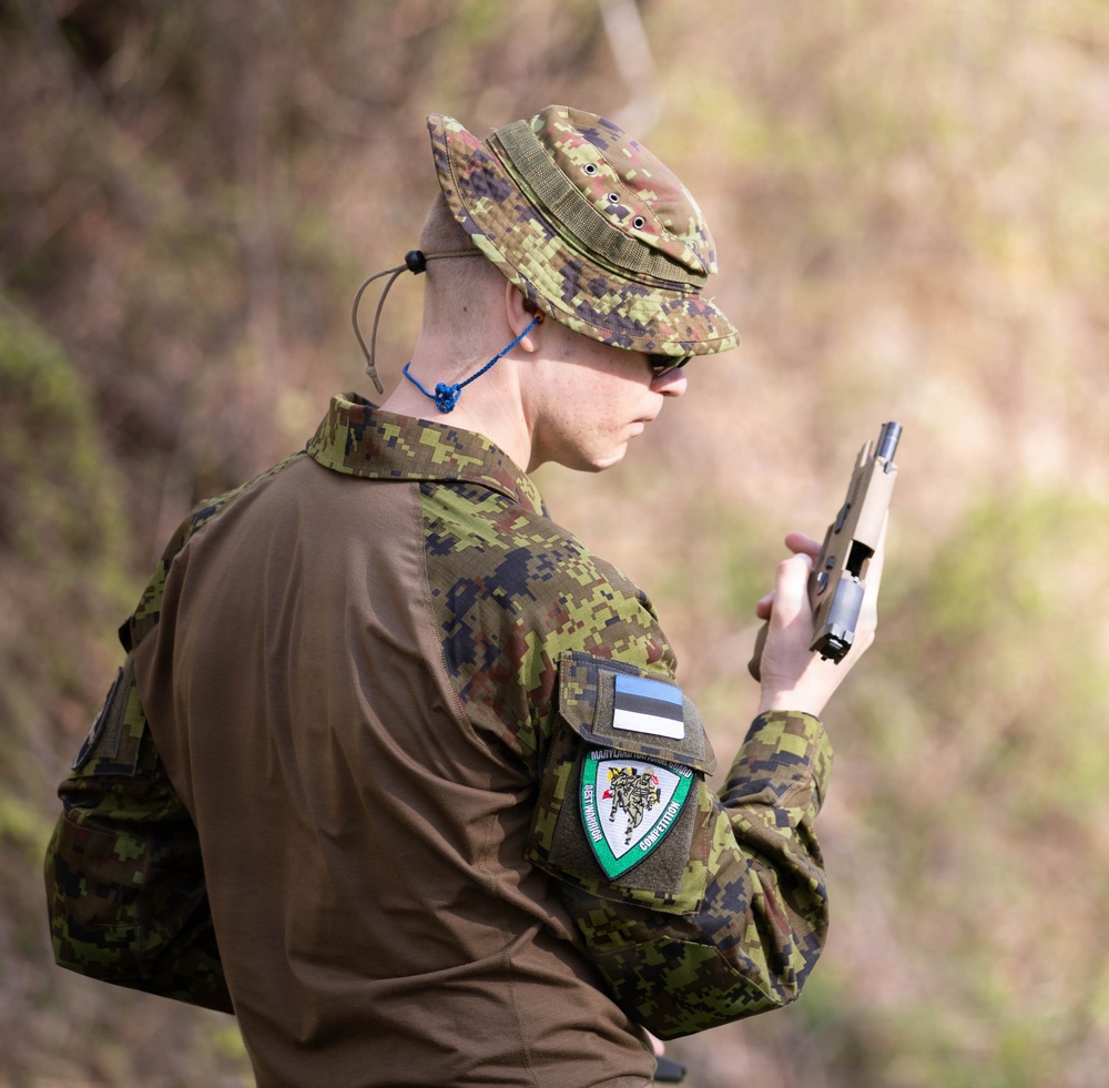 Competitor inspects pistol