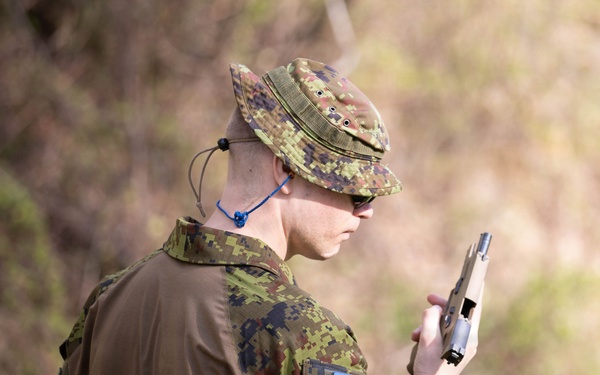 Competitor inspects pistol