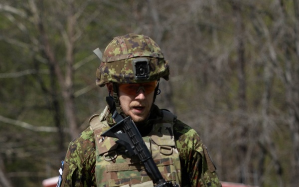 Competitor carries water cans
