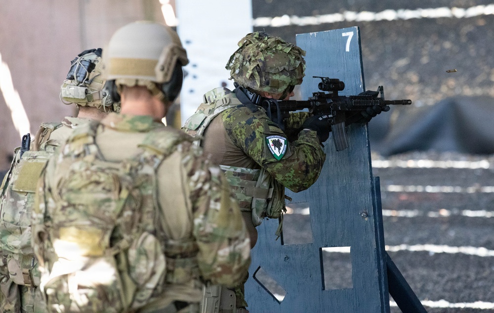 Competitor prepares to fire at target