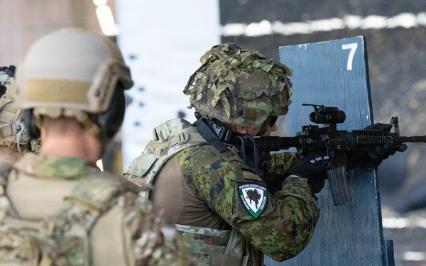 Competitor prepares to fire at target