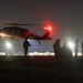 Soldiers rig cargo net loads for UH-60 Black Hawk resupply during nighttime JRTC operations