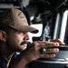 USS Mitscher (DDG 57) Sailor stands watch on ship bridge