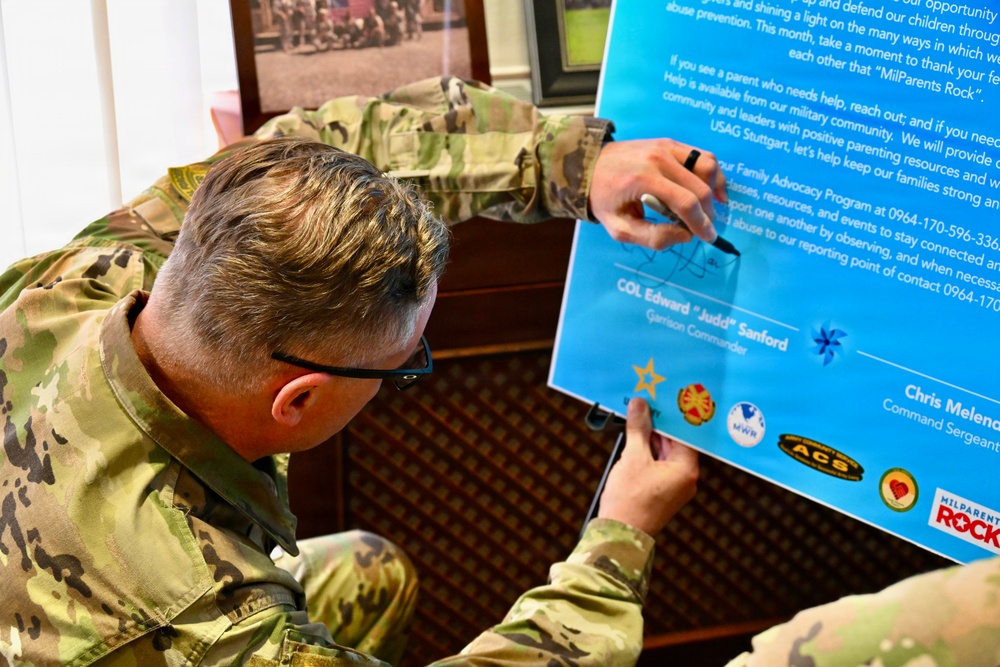 Col. Edward Sanford and Command Sgt. Maj. Chris Melendez sign the Child Abuse Prevention Month Proclamation