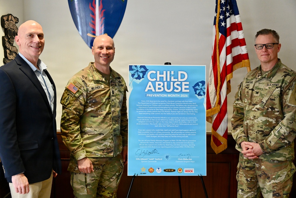 Col. Edward Sanford and Command Sgt. Maj. Chris Melendez sign the Child Abuse Prevention Month Proclamation