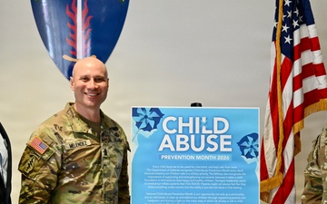 Col. Edward Sanford and Command Sgt. Maj. Chris Melendez sign the Child Abuse Prevention Month Proclamation