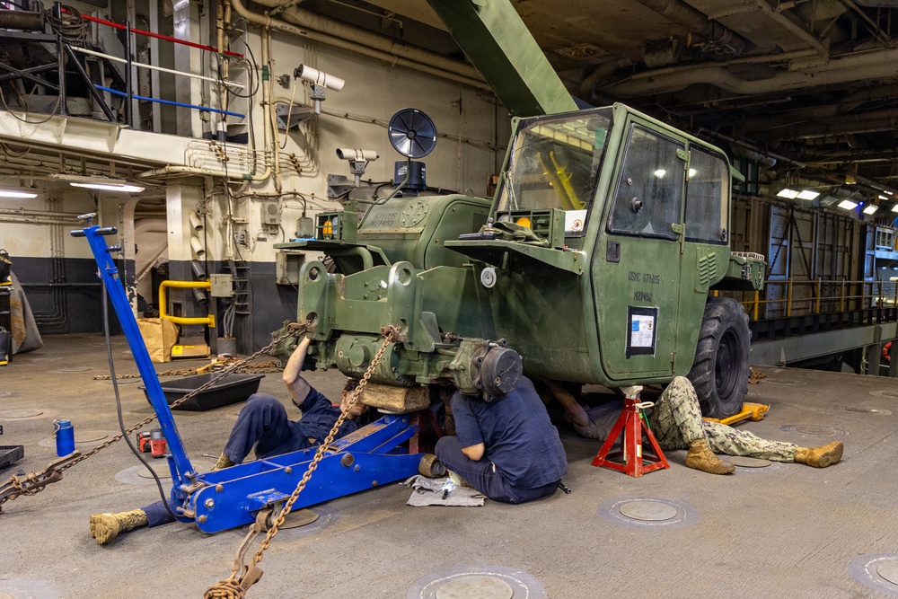 22nd MEU (SOC) | CLB 26 Marines Conduct Maintenance on an Extended Boom Forklift