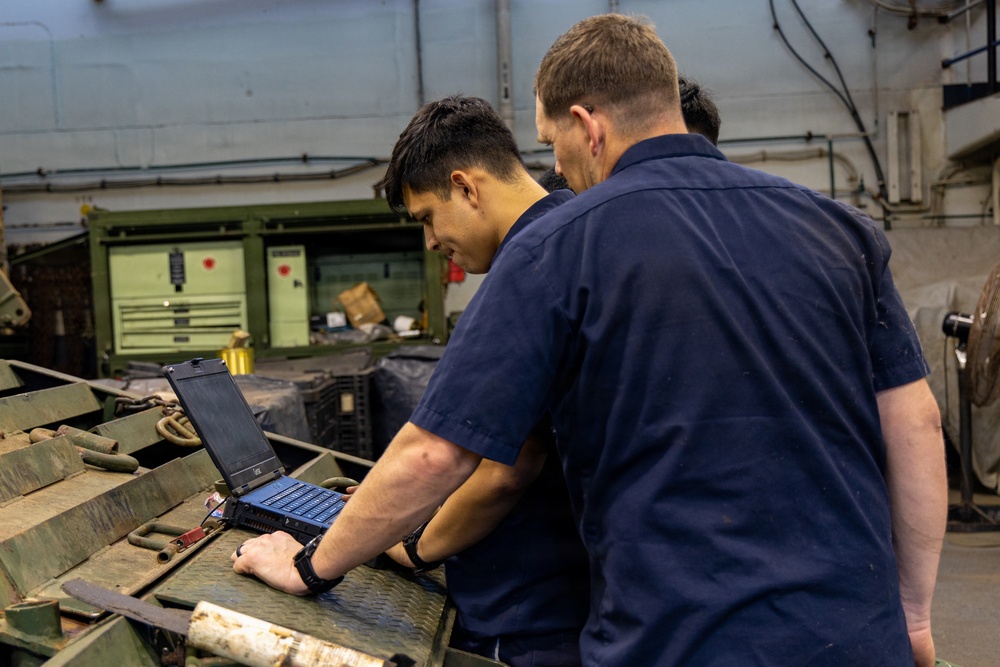 22nd MEU (SOC) | CLB 26 Marines Conduct Maintenance on an Extended Boom Forklift