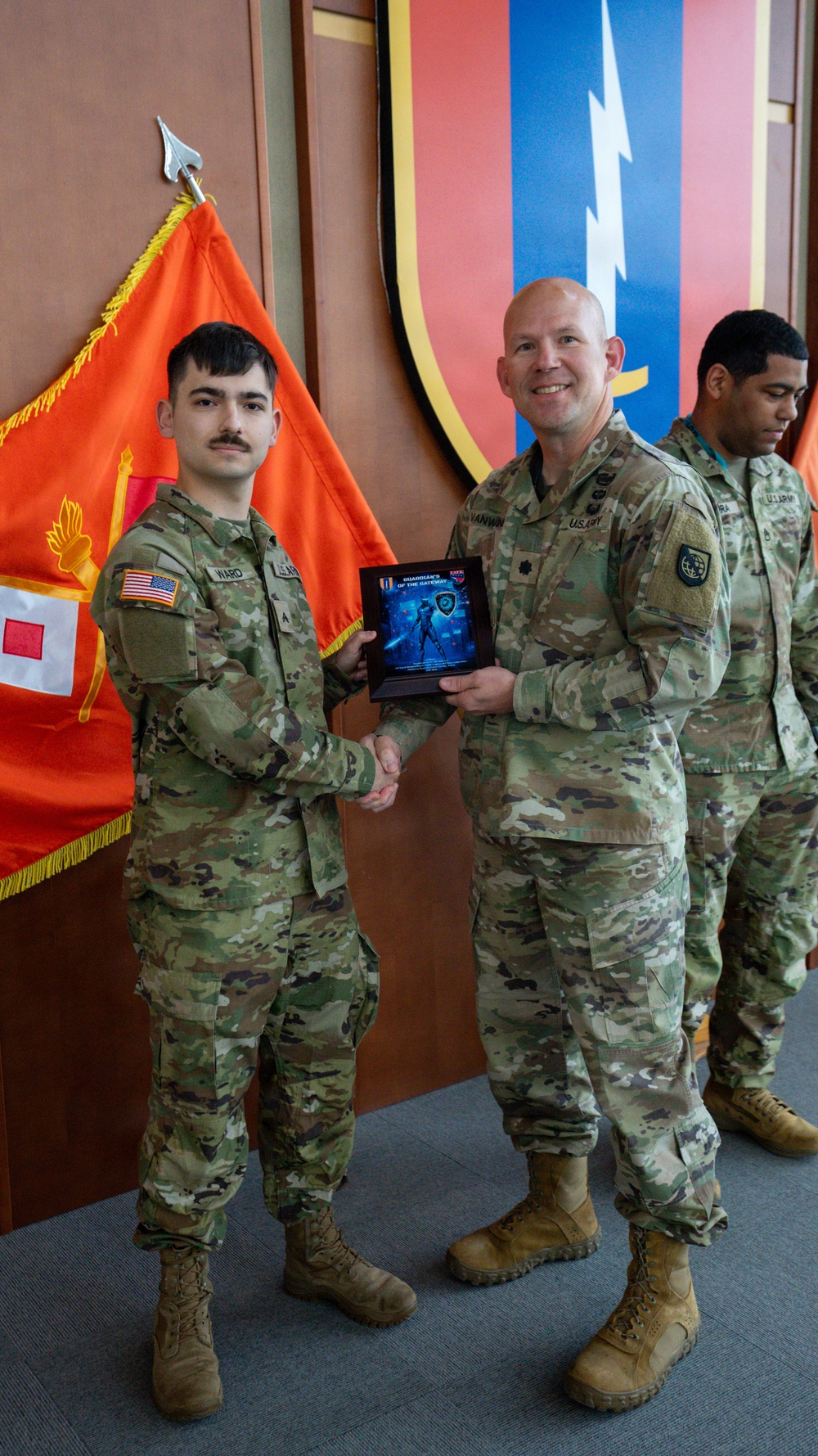 Soldier receives award from LTC Vanwinkle