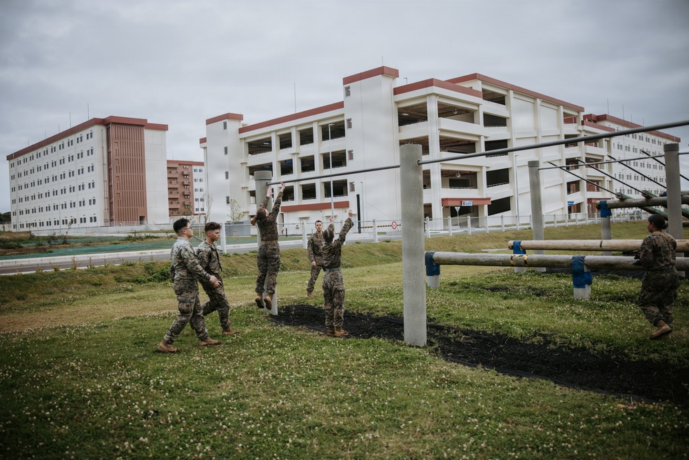 U.S. Marines tackle obstacle course during communication strategy and operations field training exercise