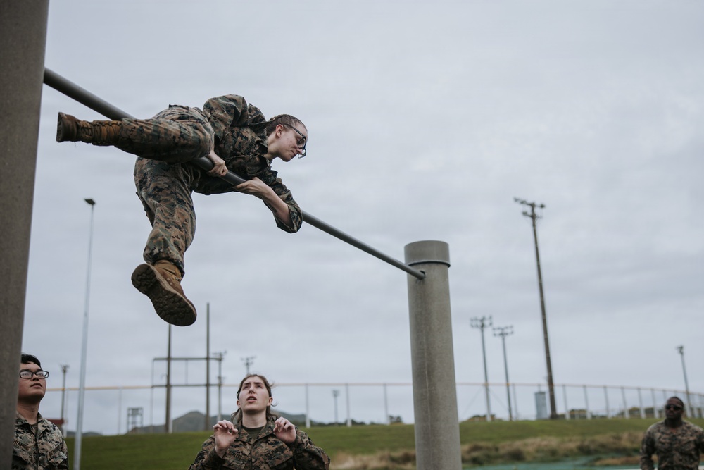 U.S. Marines tackle obstacle course during communication strategy and operations field training exercise