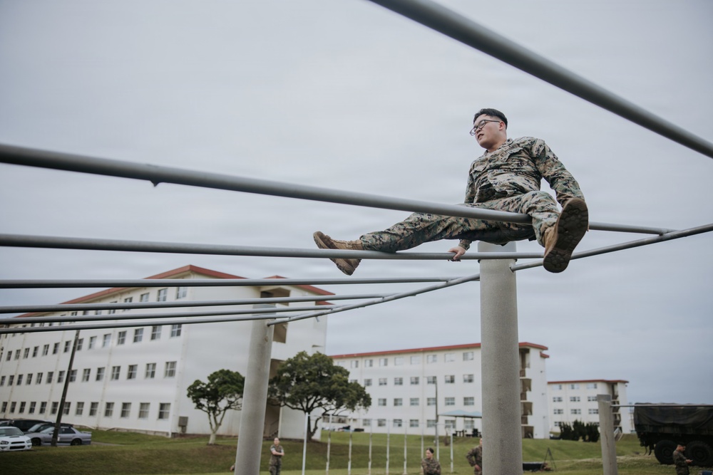 U.S. Marines tackle obstacle course during communication strategy and operations field training exercise