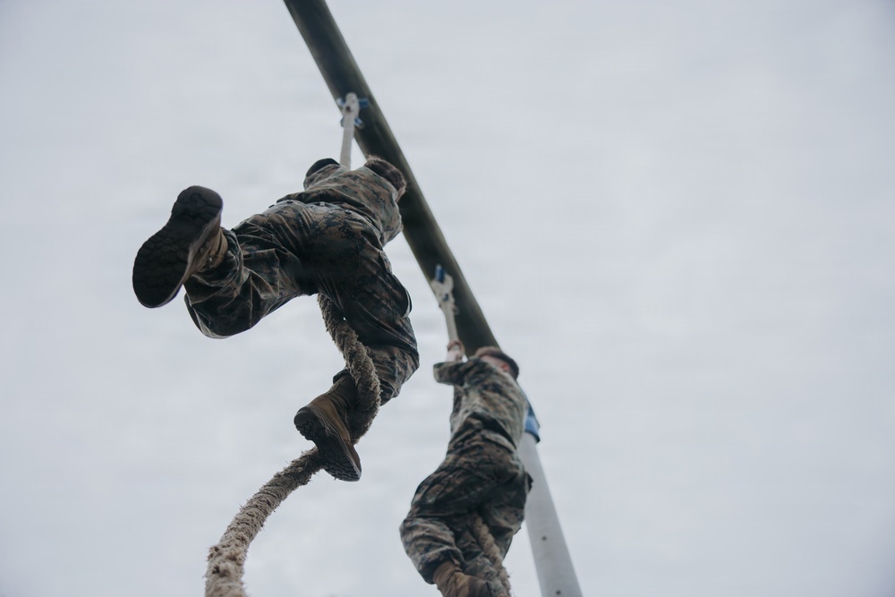 U.S. Marines tackle obstacle course during communication strategy and operations field training exercise
