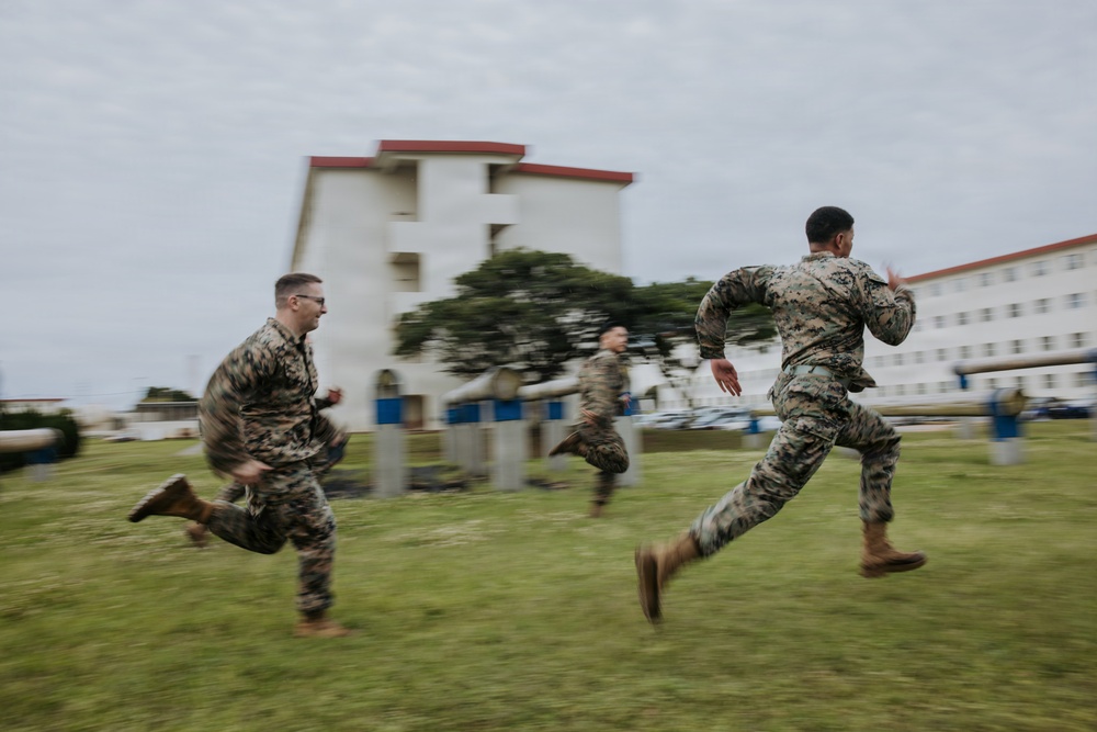 U.S. Marines tackle obstacle course during communication strategy and operations field training exercise
