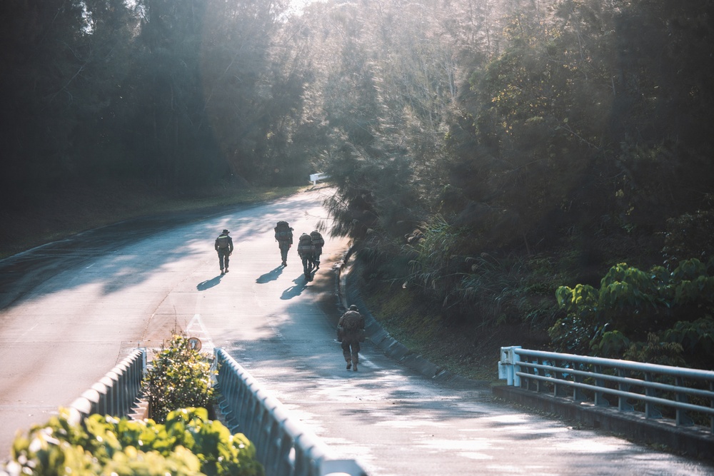 U.S. Marines conduct hike during communication strategy and operations field training exercise