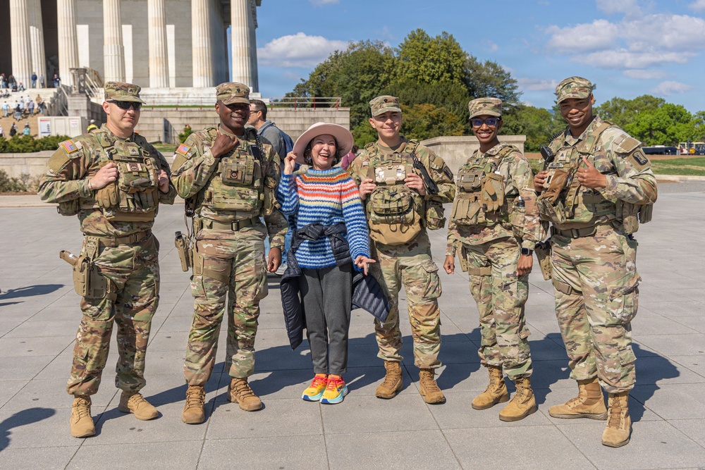 Mississippi National Guard Soldiers take a picture with members of the public in Washington, D.C.