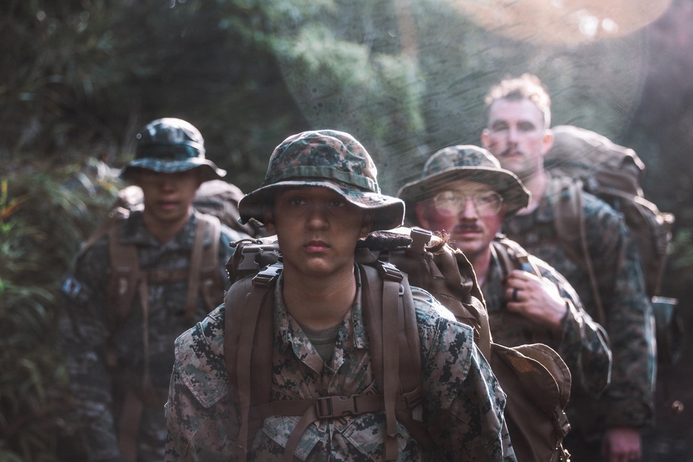 U.S. Marines conduct hike during communication strategy and operations field training exercise