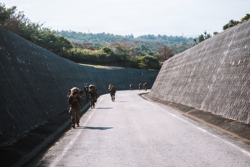 U.S. Marines conduct hike during communication strategy and operations field training exercise