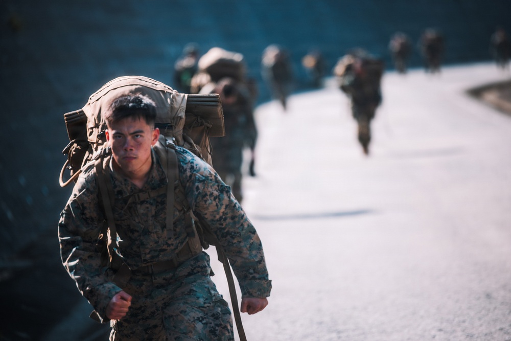 U.S. Marines conduct hike during communication strategy and operations field training exercise