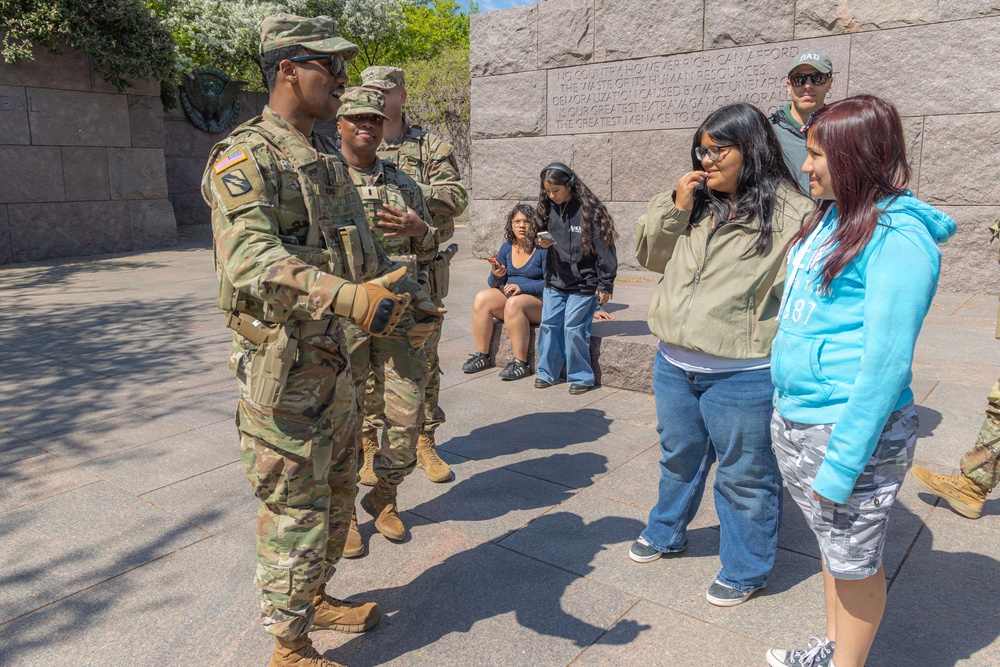 A Mississippi Army National Guard Soldier talks to a member of the public in Washington, D.C.