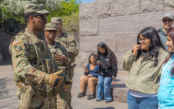 A Mississippi Army National Guard Soldier talks to a member of the public in Washington, D.C.
