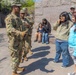 A Mississippi Army National Guard Soldier talks to a member of the public in Washington, D.C.
