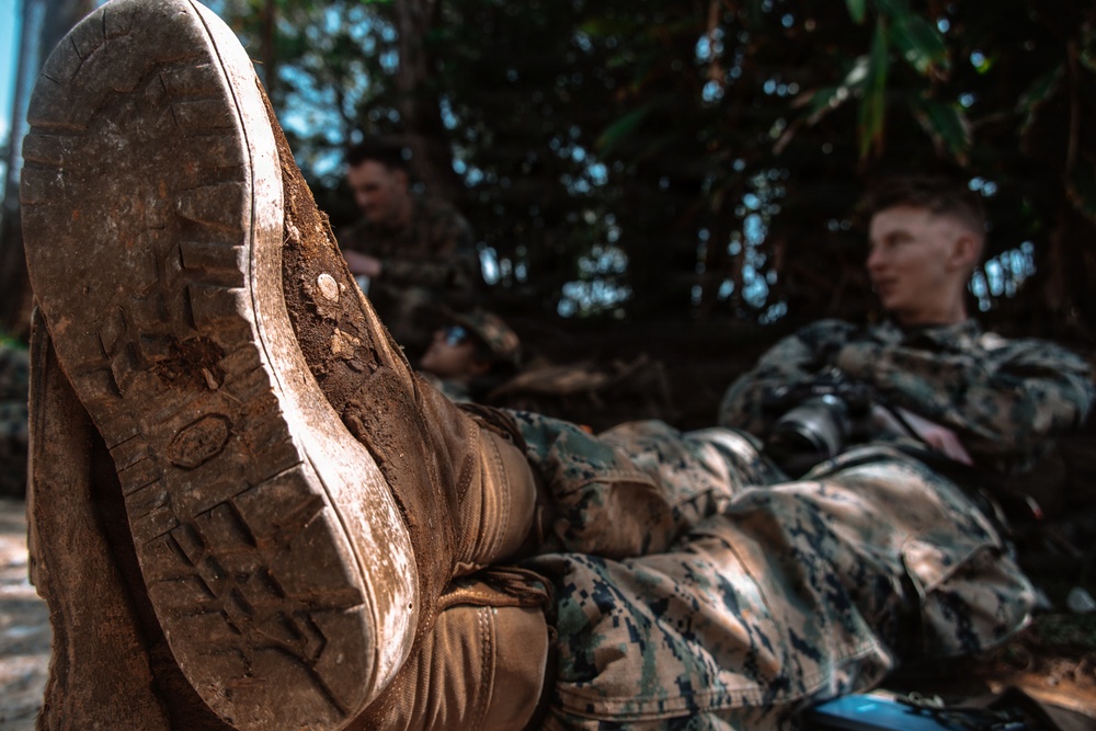 U.S. Marines conduct hike during communication strategy and operations field training exercise