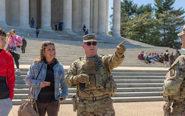 Mississippi National Guard Soldier helps a member of the public with directions