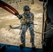 7th SFG (A) soldier rappels from a UH-60
